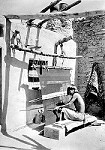 Hopi man weaving