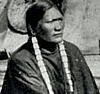 Native American in front of his tent
